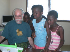 Tom teaching XOs to Axim children